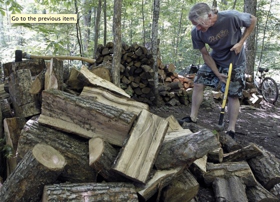 Visitor Splitting Firewood